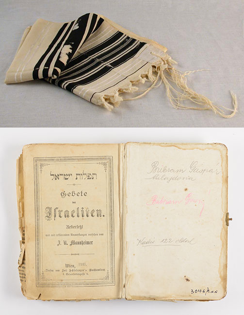 Prayer shawl and prayer book found on a pile of clothes at Majdanek
