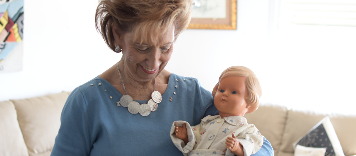 Lore (Stern) Mayerfeld with the doll she donated to Yad Vashem, Jerusalem, 2018