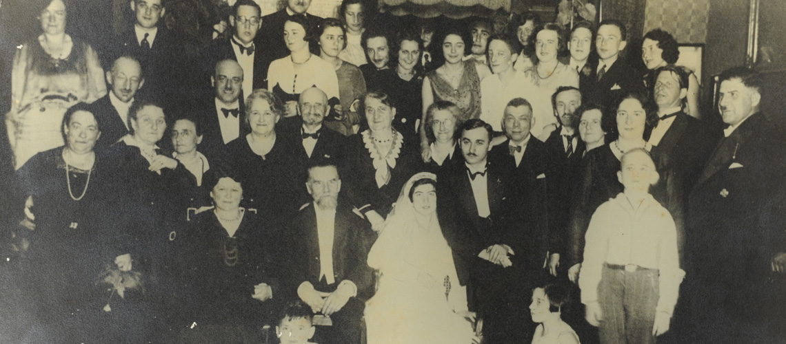 Avraham-Arthur and Rachel-Martha Fiebermann on their wedding day, surrounded by family members. Frankfurt-am-Main, Germany, 1932