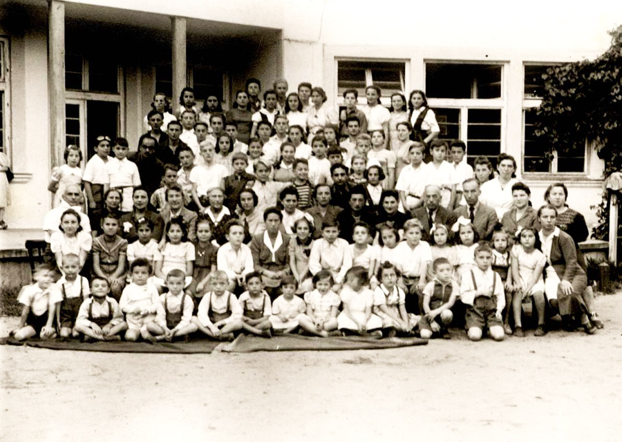 Group photograph of the children and staff of the home