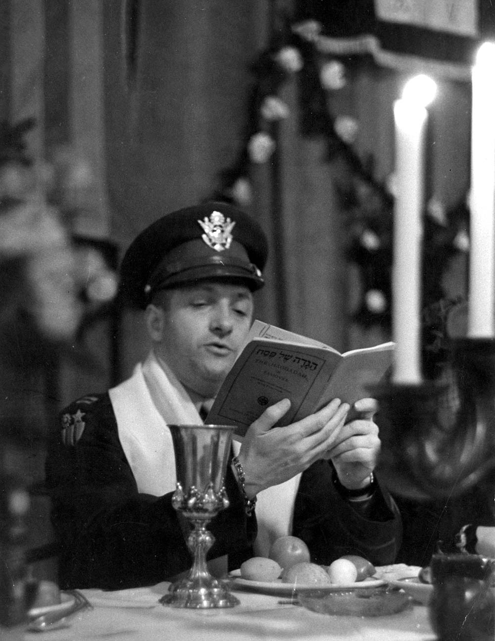 Rabbi Dalin reading from the Haggada at a Passover Seder at the American Airforce base, Frankfurt am Main, Germany, postwar