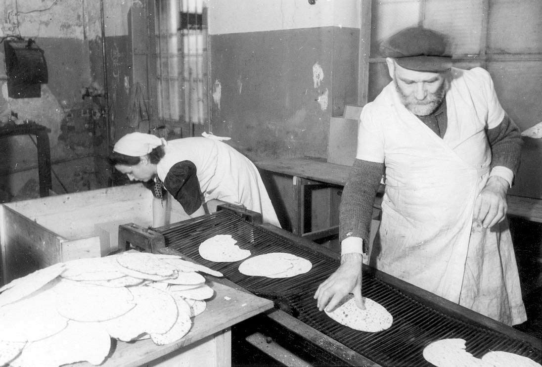 Baking matzah in a DP camp, Zeilsheim, Germany, postwar
