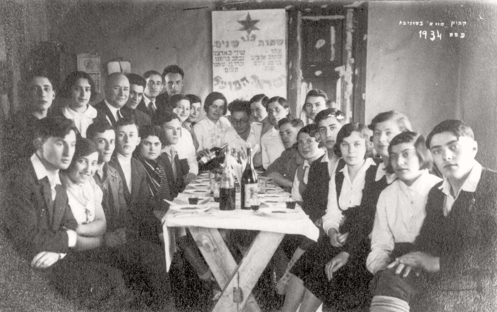 Passover at  Kibbutz Chaim, an urban kibbutz, Panevezys, Lithuania, 1934<br>Zelda Charit is second from the right. Rivka Shub is seventh from the left, in a light colored shirt.