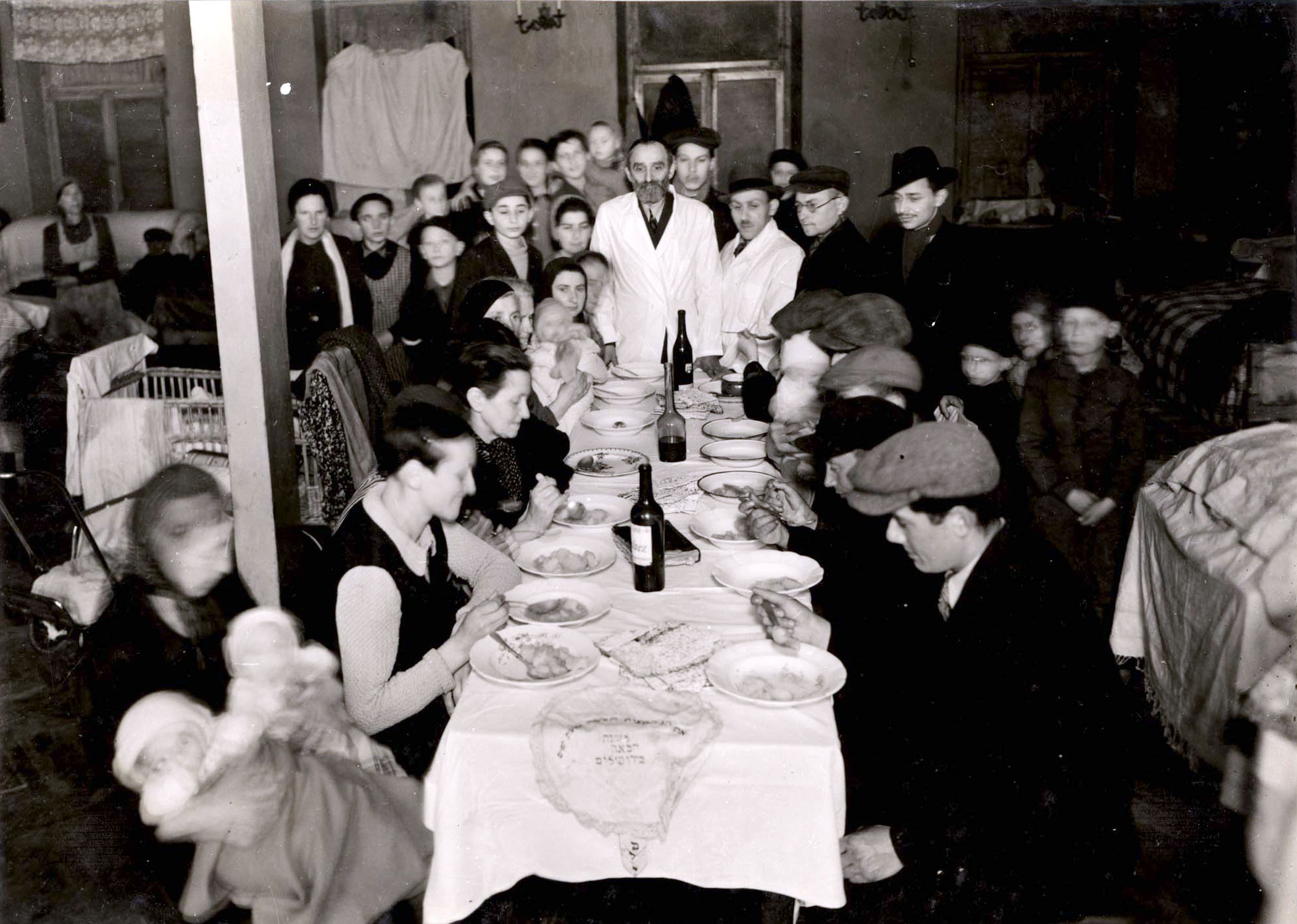 Warsaw, Poland, Jews sitting around the Seder table on 7 Dzielna St. in the ghetto