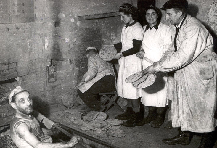 Baking matzah in hiding, Lodz, Poland, 1943