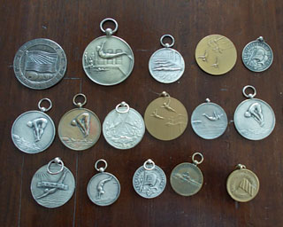 Bob Denneboom's medals and badge from Amsterdame Zwemclub AZ