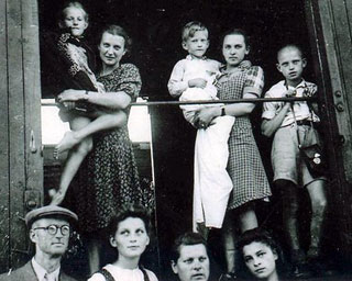 On the train from Lithuania to Germany. Ona is holding Judi and Ona's sister Ale is holding Tadas. Breslau, 1944