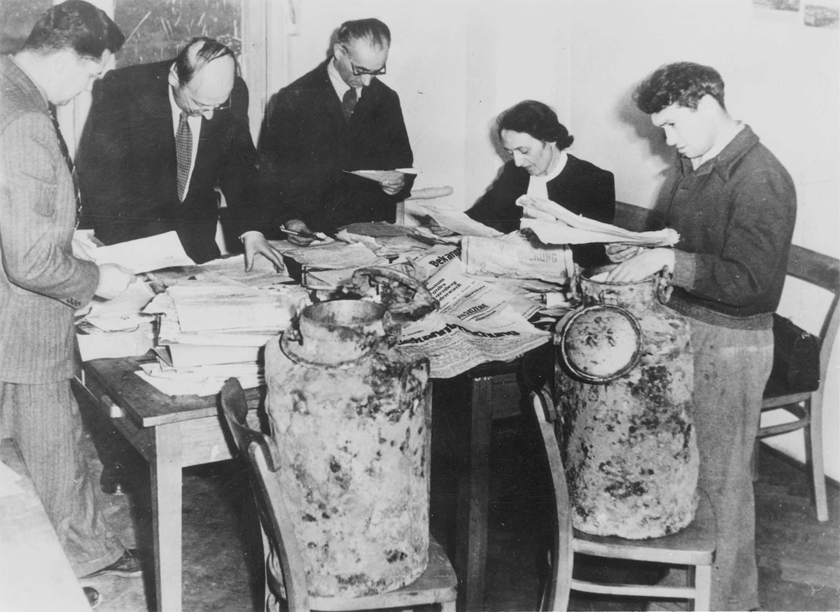 Researchers from the Jewish Historical Institute classifying the Ringelblum archive. Warsaw, Poland, December 1950