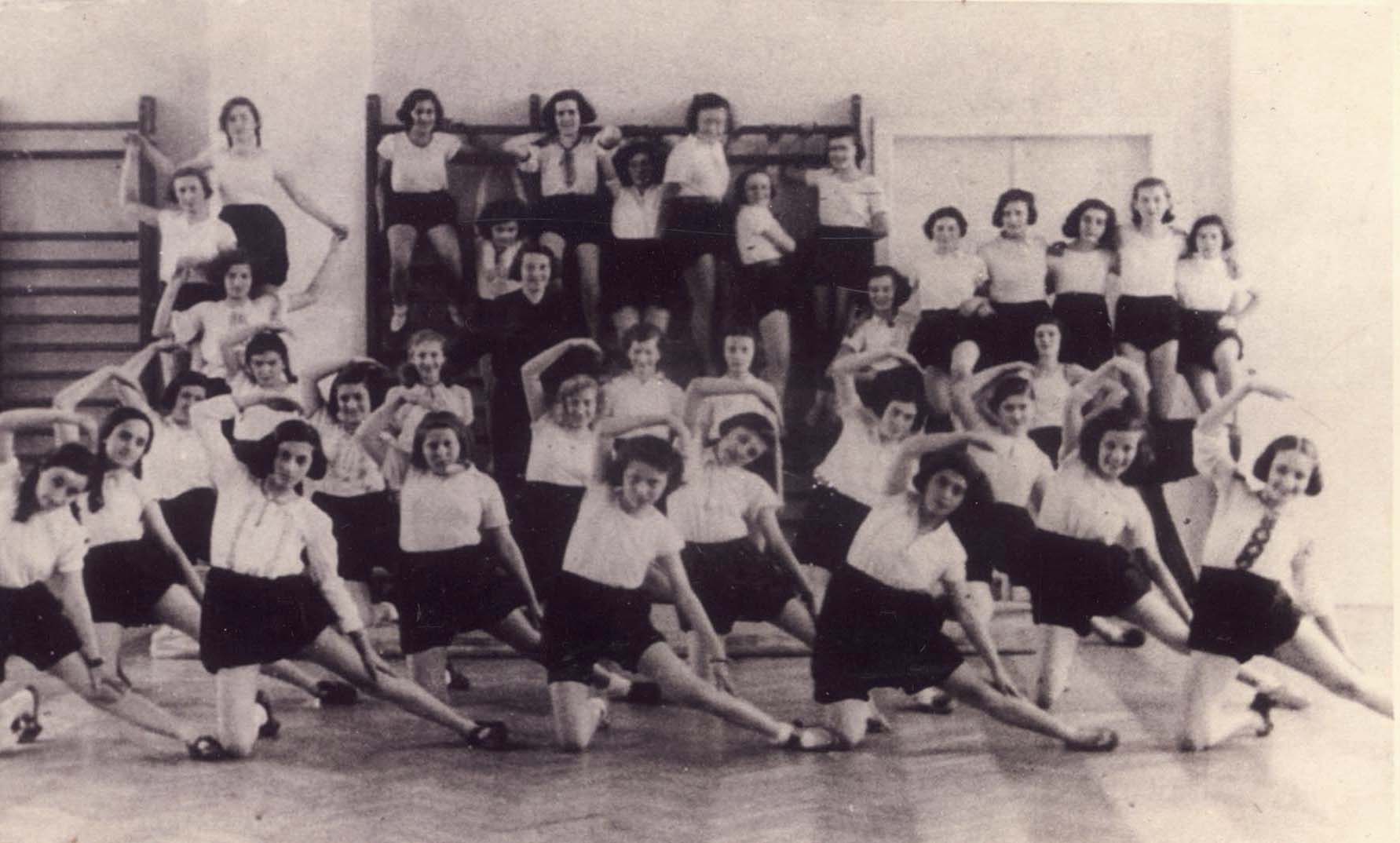 Girls during gymnastics class at the Jewish High School for Economics. Krakow, Poland, 1936