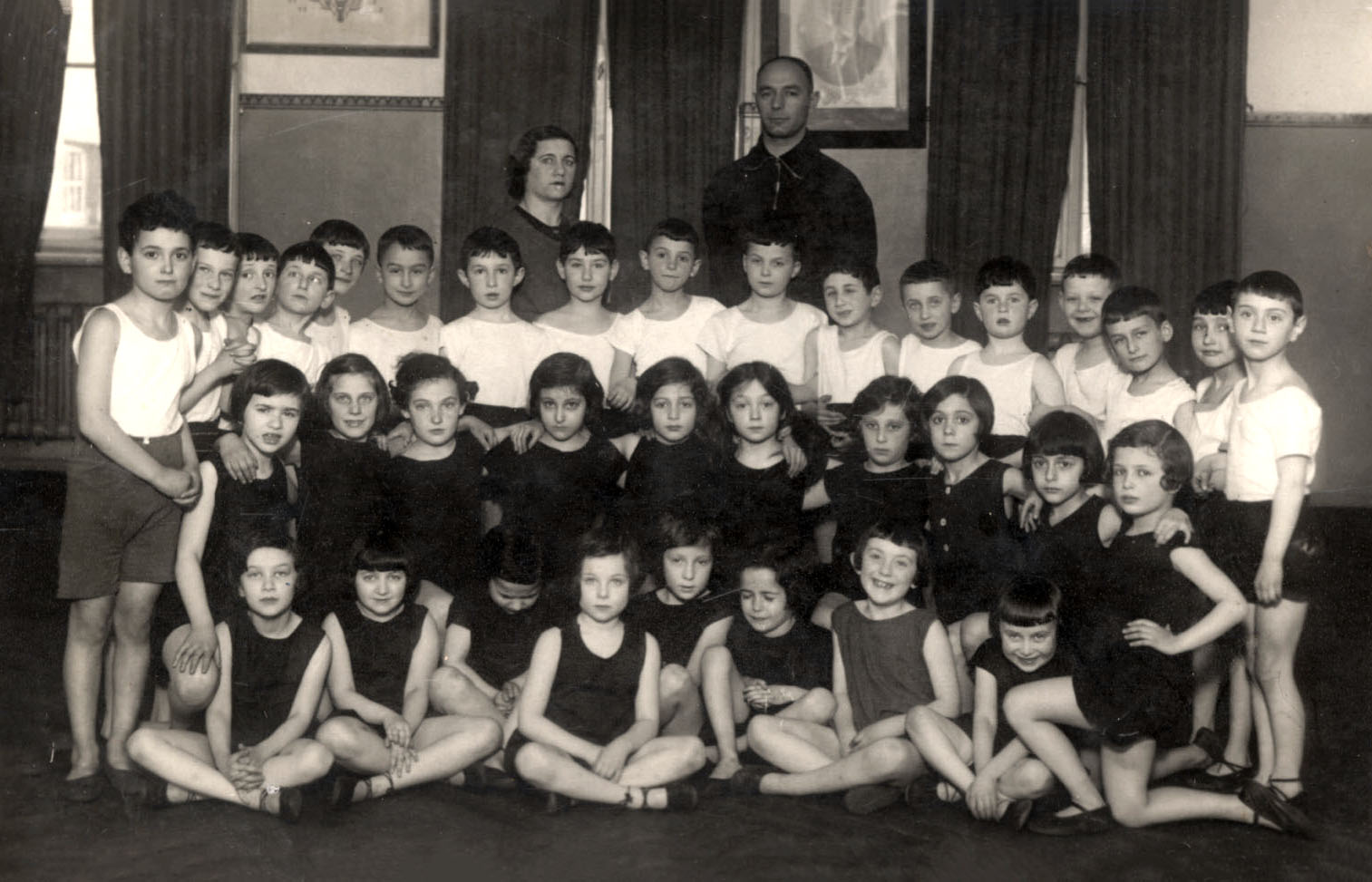A group photograph of "Mechina" (preparatory) Class B at a physical education class, Riga, Latvia, 1933