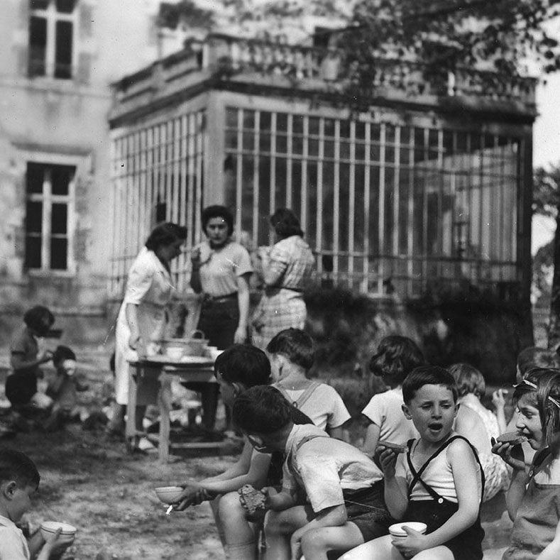 Ehud Loeb (front, with the crossed-over shoulder straps) at the children's home in Chabannes, 1941
