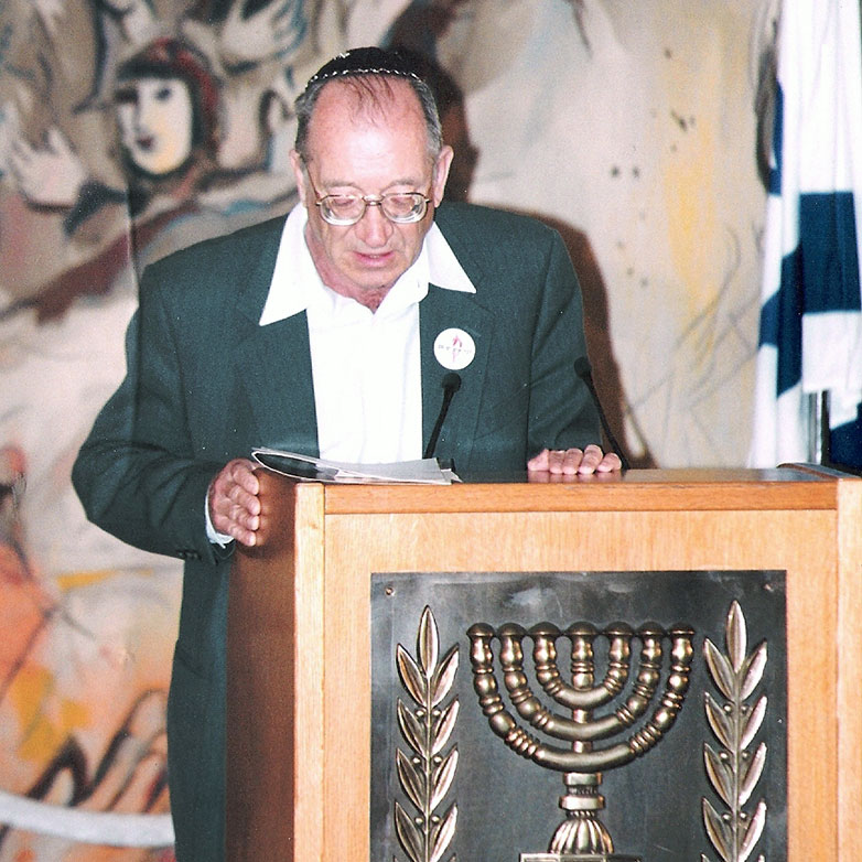 Haim Roet reading names of Holocaust victims in the commemorative project “Unto Every Person There is a Name” in the Knesset