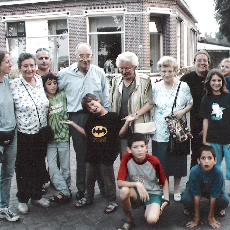 Haim along with his family and the two daughters of his rescuer outside of the home in Nieuw-Amsterdam in which he was hidden