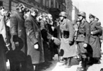 A group of Jews captured by the Germans during the suppression of the Warsaw Ghetto uprising. The subtitle under the original photo in the Stroop album reads: "Jewish Rabbis"