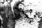 Soldiers of the Waffen SS extracting a Jewish combatant from a bunker during the suppression of the Warsaw Ghetto uprising