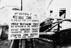 Multilingual warning sign posted by the Gęsiówka labor camp which was inside the Warsaw Ghetto