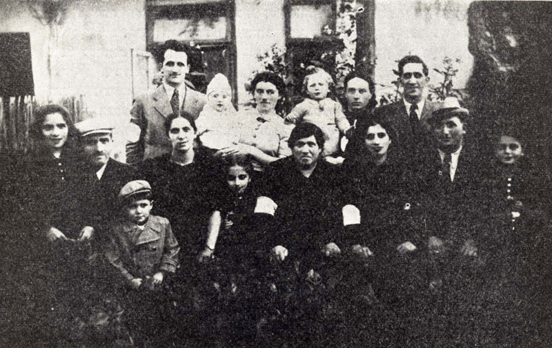 Wolbrom, the Rotmensch family - wife, children and grandchildren - with armbands