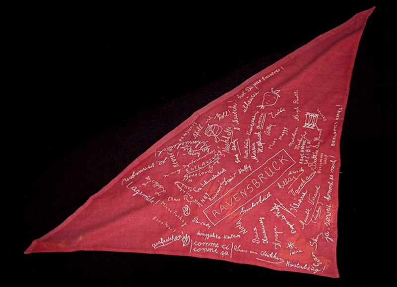 Strip of cloth left over from a Nazi flag, signed by women prisoners in Ravensbrück