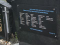 The memorial erected over the mass grave with the names of the victims who have been identified engraved alongside the numbers of those who have not yet been identified.