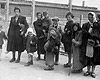 Аушвиц-Биркенау, Польша. Женщины и дети, признанные непригодными к работе, на пути в газовые камеры.
